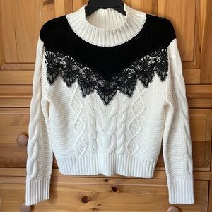 Like new black and cream sweater with crochet type trim